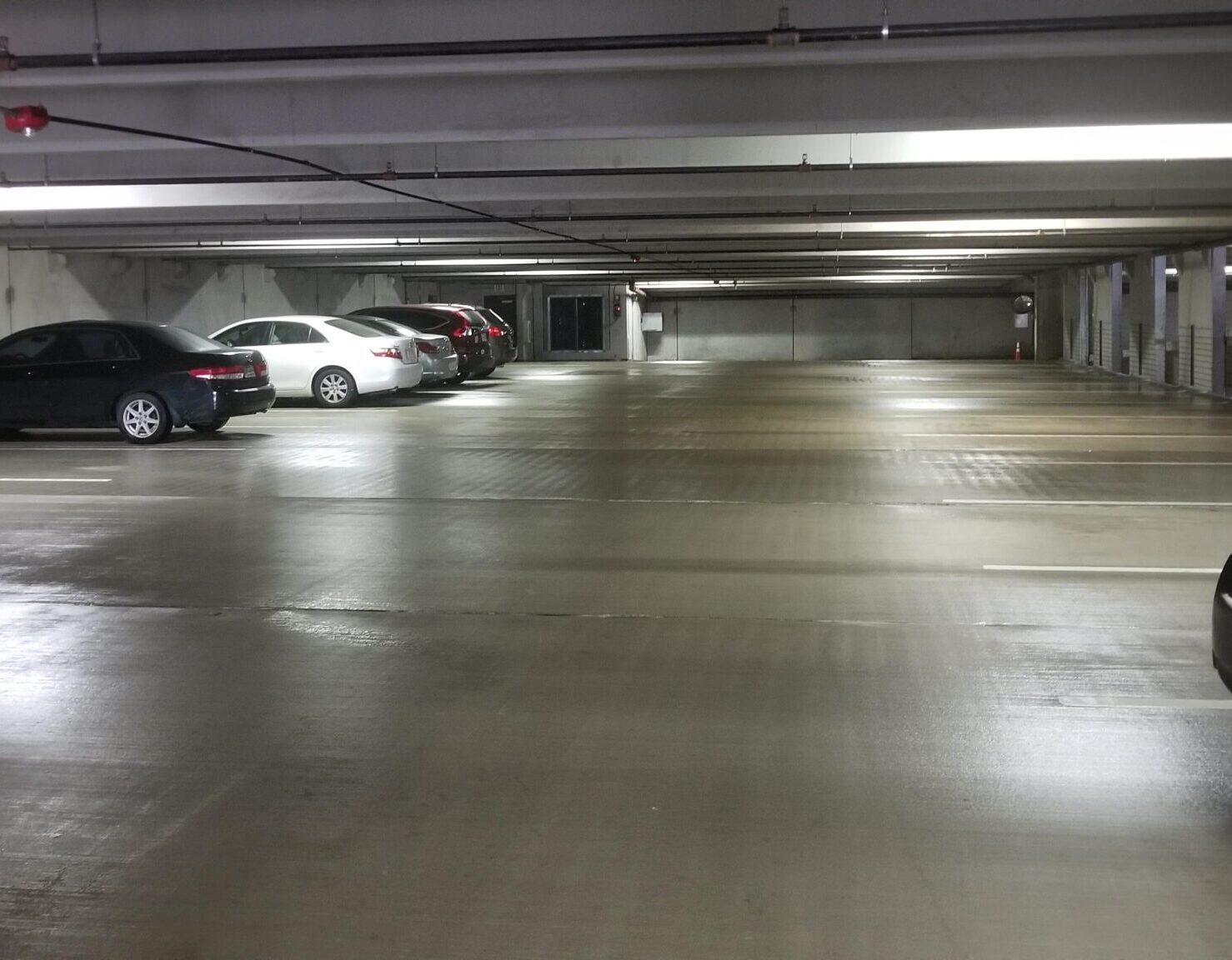 wet floors from recent parking garage washing project