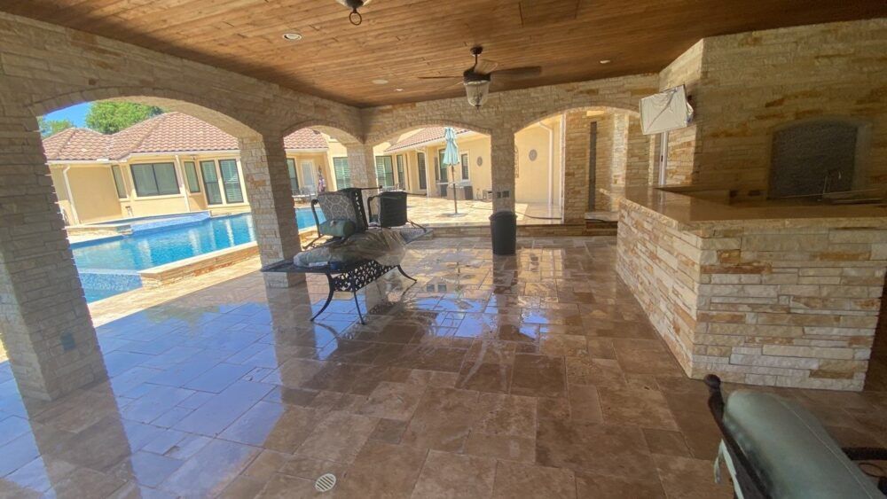 Residential patio still wet from recent pressure washing