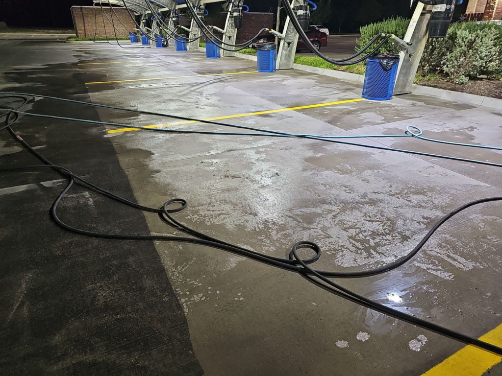 clean concrete next to dirty concrete after being pressure washed and acid washed